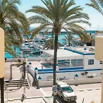 With Terrace And Pools In The Port Estepona